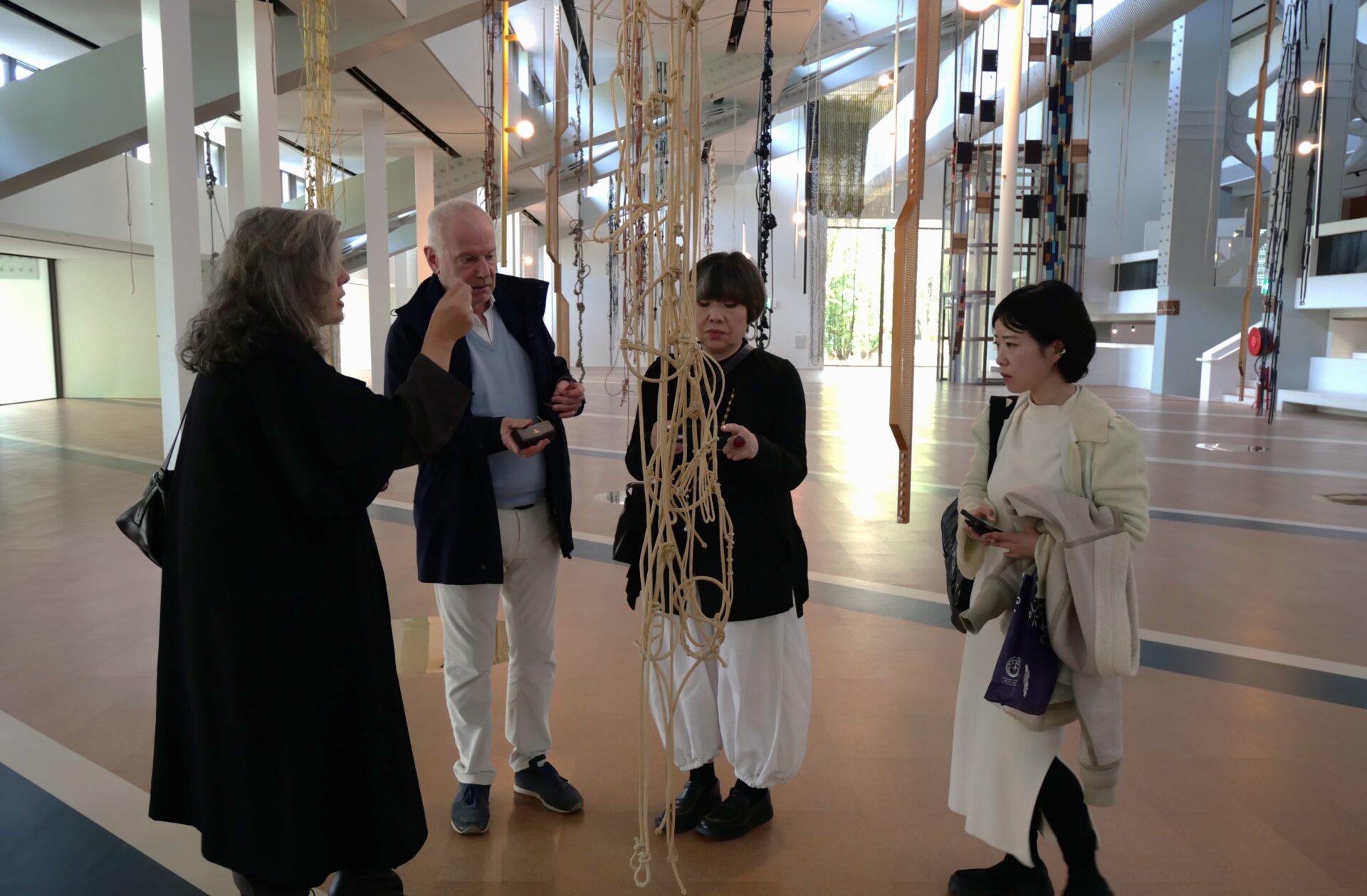 Mitome, Kataoka, Weil, and an artist based in Lisbon, inspecting the CAM venue together.