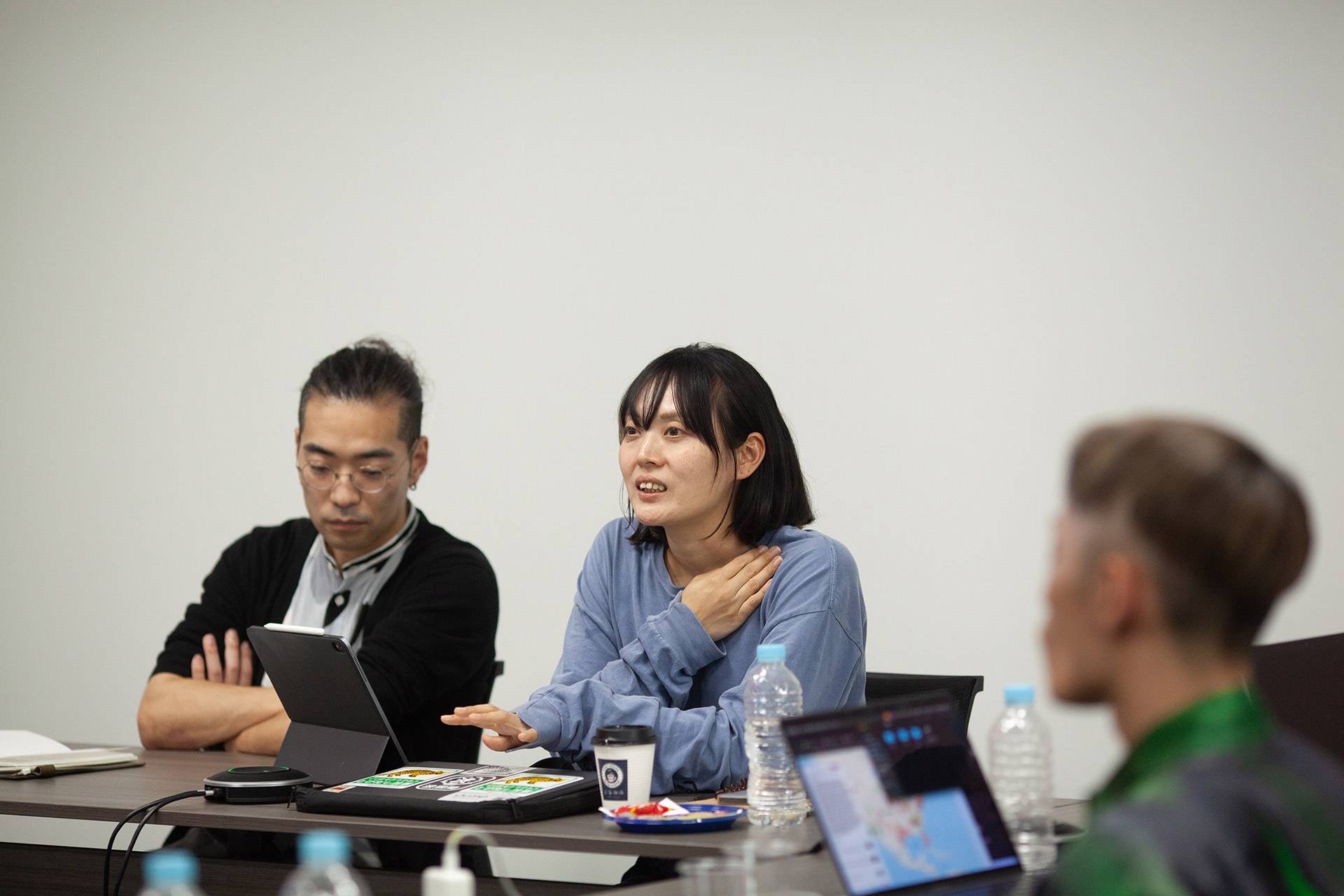 Endo and Arai giving a presentation